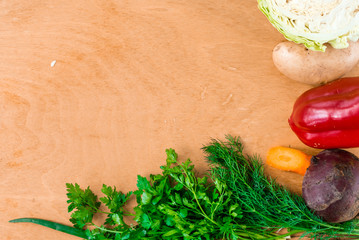 The layout of spring vegetables on a cutting board from above. Background layout with free text space.