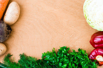 The layout of spring vegetables on a cutting board from above. Background layout with free text space.
