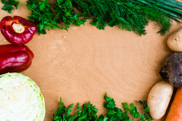 The layout of spring vegetables on a cutting board from above. Background layout with free text space.