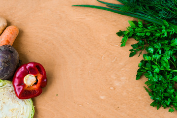 The layout of spring vegetables on a cutting board from above. Background layout with free text space.