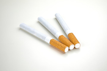 Close up of a smoking cigarettes on white