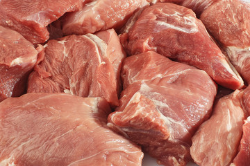 Slices pork loin on a white background. Raw pork . Advertising for meat shop and farm. Various kinds of meat and ready to cook concept. Top view. Space for text