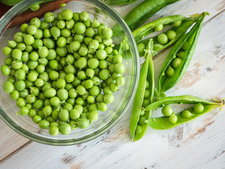 fresh peas on a glass bowl