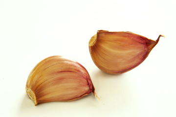Garlic cloves on a white background