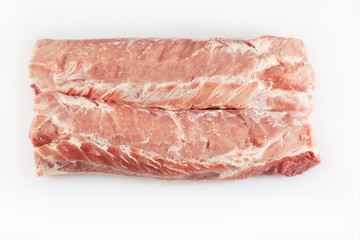 Pork belly isolated on white background. Top view. Fresh pork ribs isolated on white background. With clipping path. Raw meat, farm and cooking concept. Meat shop.