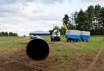 Sections of pipe on top of wooden supports at an construction site for natural gas. Construction...