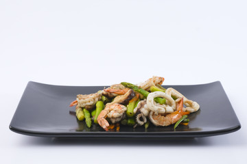 Stir fried asparagus with squid and shrimp with oyster sauce.