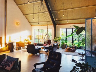Loft style living room interior with design furniture. Scandinavian living. 