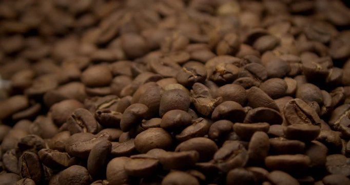 closeup of falling coffee beans in studio shoot from 12o fps
