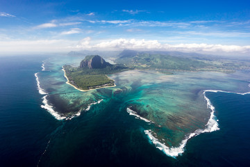 Incredible view of the famous underwater waterfall in Mauritius. Picture taken from helicopter - obrazy, fototapety, plakaty