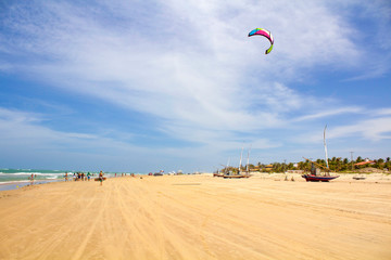 Tourists on the beautiful beach of Brazil and man practicing sport. Flexeiras beach, in Ceara, northeast of Brazil. 