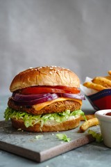 Homemade Veggie Burger with tender Jackfruit with side fries, selective focus