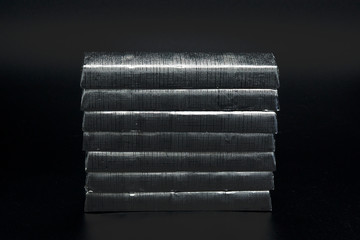 paralleled chocolate bars in silver packaging