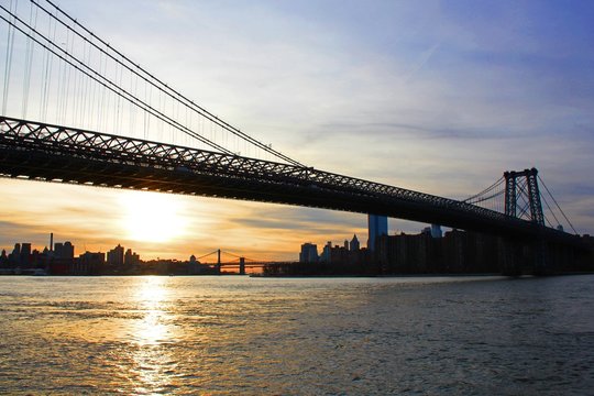 New york, USA - 20/12/2019: williamsburg bridge in New York Manhattan skyscrapers behind at sunset - stock photo