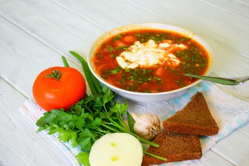 Sour borsch with a chapel, bacon and sour cream