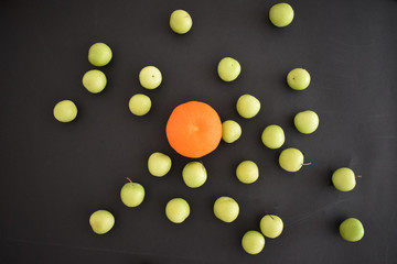 Fototapeta na wymiar mandarin and green plum 