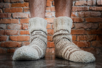men's legs in warm knitted wool socks