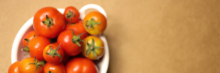 tomatoes on brown background. Top view, Copy space for the ads