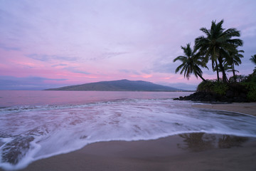 Beautiful calm morning waves swirl in at Kalepolepo Beach Park, Kihei, Maui, Hawaii. 