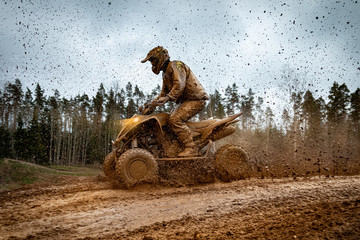 Quad bike in mud. ATV Rider in the action. © Zigmar Stein