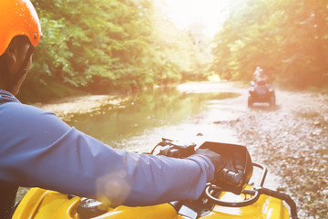 A first-person person driving an off-road ATV, a view from the ATV. © Alexander