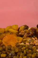 background of mixture of nuts and raisins, closeup