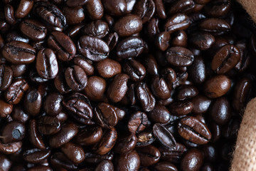 Roasted coffee beans texture, used as a background.Flat lay, top view, copy space.
