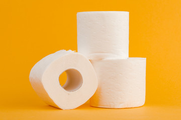 Toilet paper roll on a yellow background.
