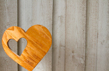 Background with love topic: wooden wall with heart and copy space