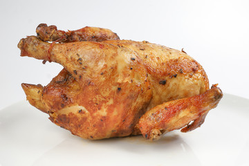 Whole roasted grilled chicken poultry bird on white background