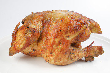 Whole roasted grilled chicken poultry bird on white background