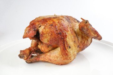 Whole roasted grilled chicken poultry bird on white background
