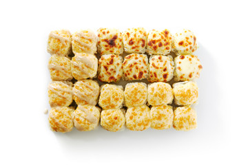 Baked rolls on white background top view