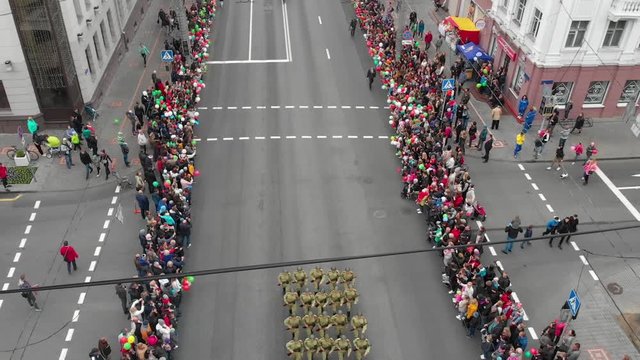 Gomel, Belarus - 05/09/2019: Military column at Victory Day parade, people greet the military, top view