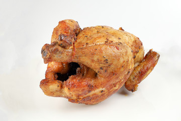 Whole roasted grilled chicken poultry bird on white background