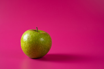 sour green apple on background