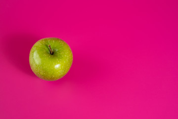 sour green apple on background