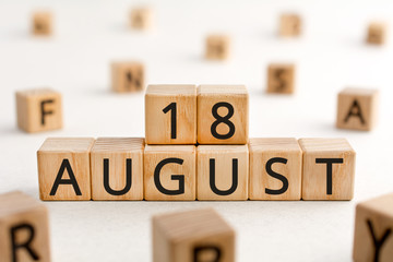 August 18 - from wooden blocks with letters, important date concept, white background random letters around