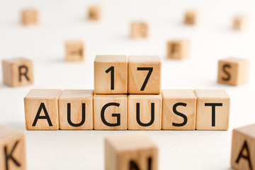 August 17 - from wooden blocks with letters, important date concept, white background random letters around