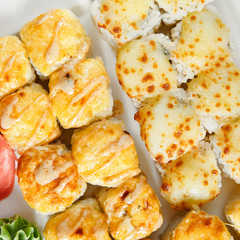 Baked rolls in white plate top view
