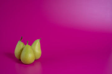green pears on background
