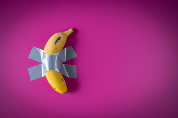 YELLOW BANANA on fuchsia background