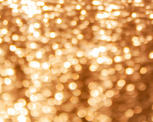 Obraz premium background with a golden glow and bokeh from a foil of a building insulation