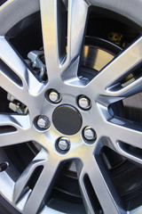Fototapeta na wymiar Alloy wheel of a modern car