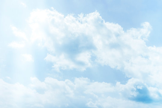 Fluffy white clouds on a clear blue background float in the sky. Spring-summer. Divine view. Concept steady pulse, calm breathing.