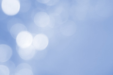 Abstract blue bokeh background. Defocused pattern for advertising, newspaper, magazine design. Universal. Soft, season, texture, color, winter, blue lights. copy space
