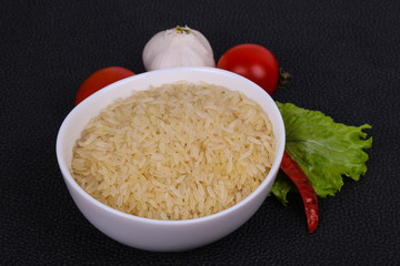 Raw uncooked rice in the bowl