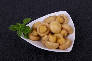 Pickled champignon heap in the bowl