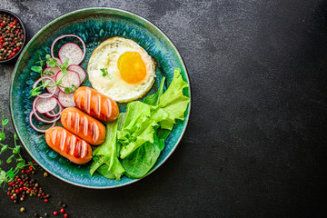 healthy breakfast, fried eggs sausages and vegetables Menu concept. food background. top view copy space for text keto or paleo diets