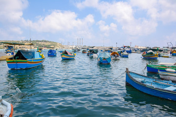 Naklejka na ściany i meble Marsaxlokk is a traditional fishing village. located southeast of Malta. Fisherman village in the south east of Malta.